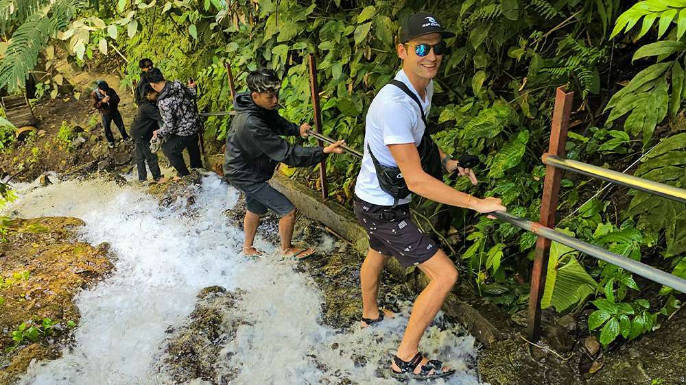 tumpak sewu hike down to the base of the waterfall
