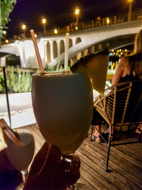 chilling by the river with a drink in seville