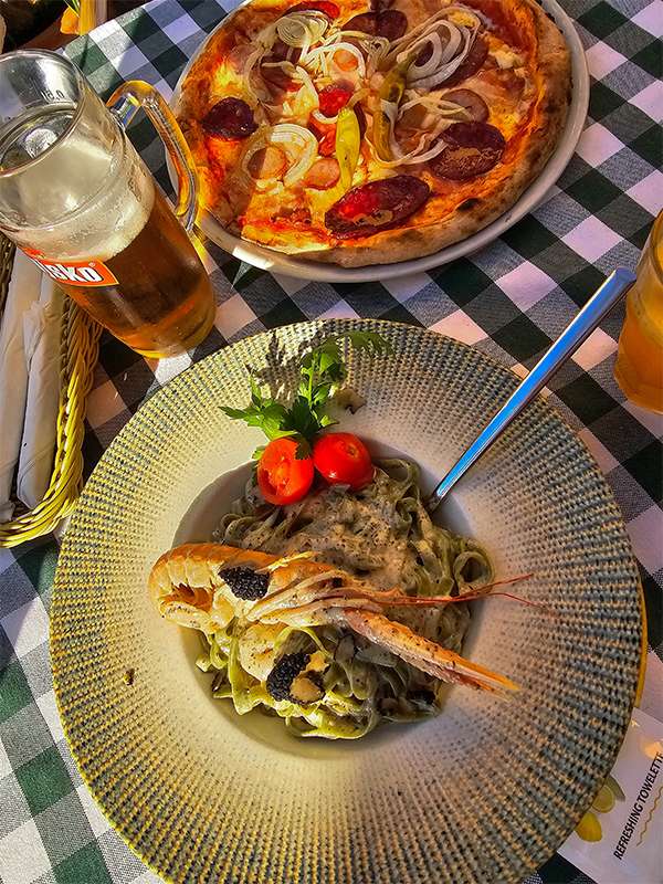 pizza and green tagliatelle with truffle at jupiter pizza pula