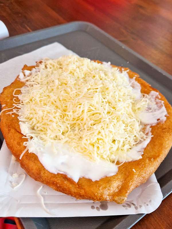 hungarian langos with sour cream, garlic and cheese