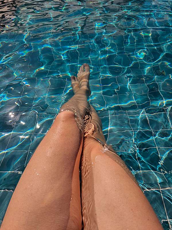 relaxing in the pool on the rooftop of my flats luxury downtown